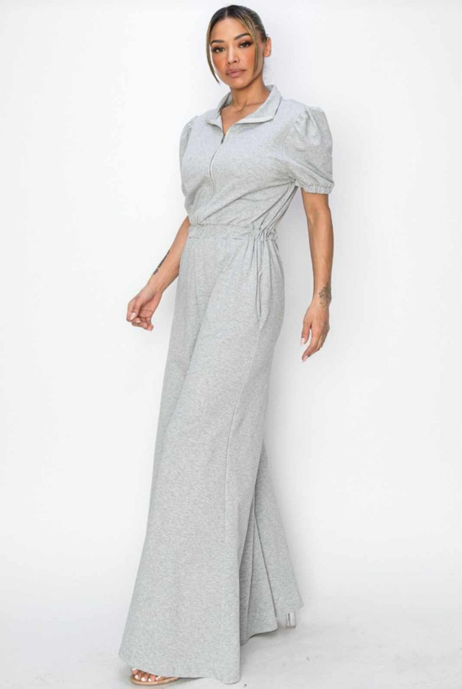 Retro Chick Jumpsuit, elastic waist and puff capped sleves, upper zipper and  wide leg bell bottom legs and pockets. Available in Heather Gray or Mint Green