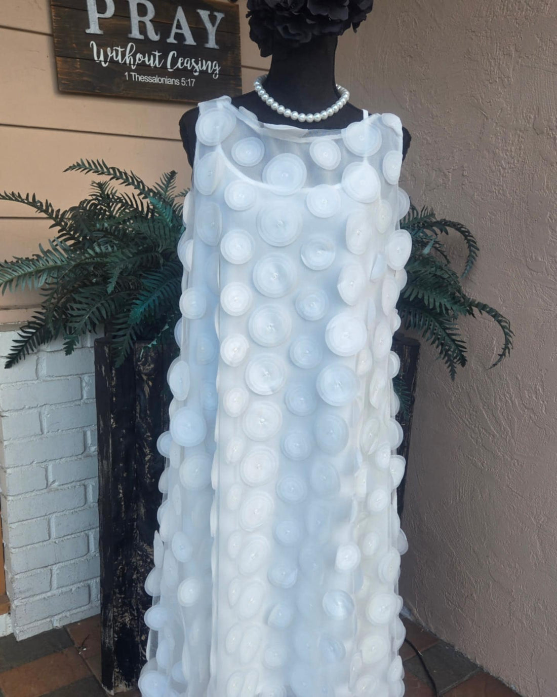 asymmetrical dress with spaghetti strap chiffon dress under and layered with a sheer solid white spiral pattern upper. 