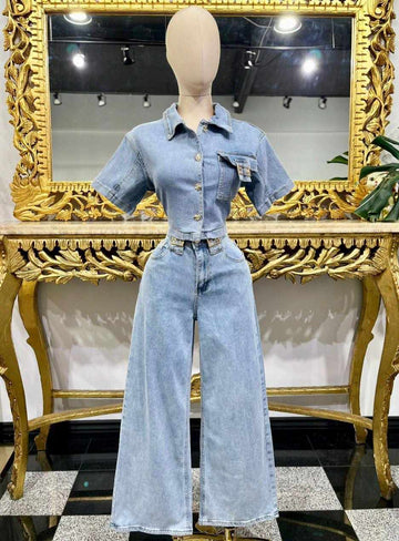 matching denim set, with short sleeves button up wide leg pants and gold tone accent pieces. 